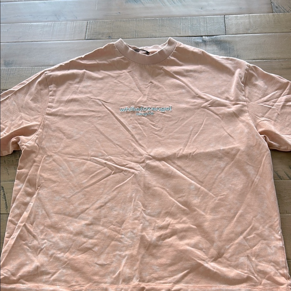 White Fox oversized orange acid wash tee. Embroidered “White Fox Angel” on it